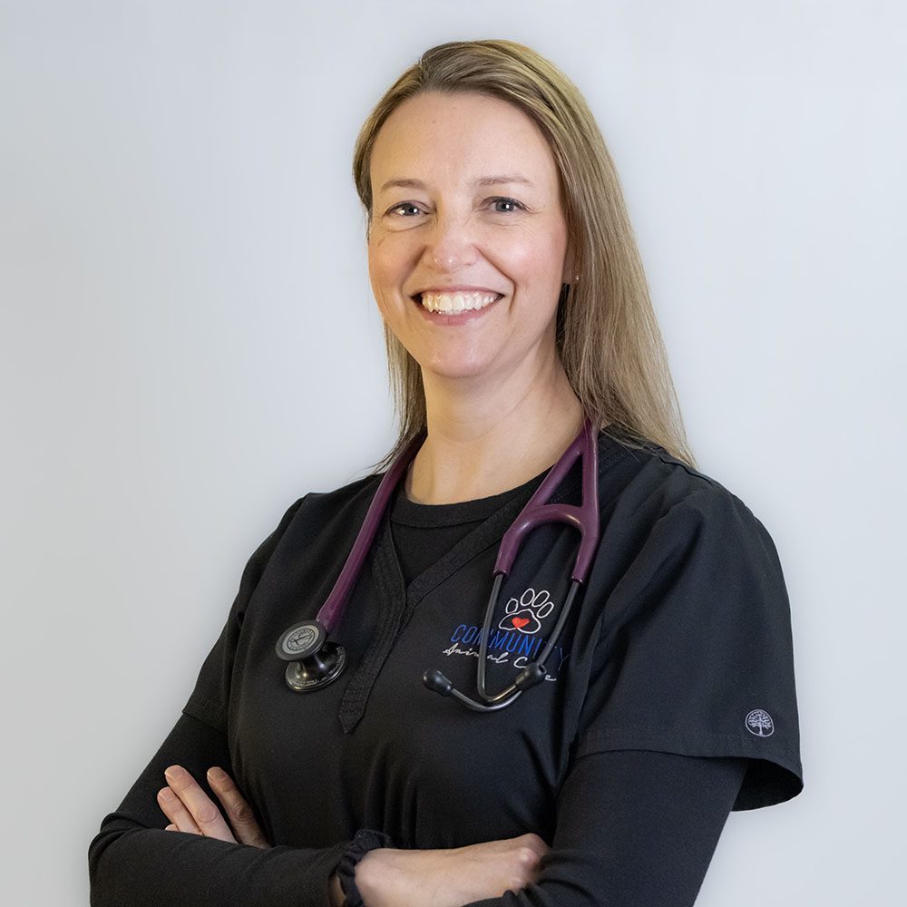 Dr. Melissa Pelesz smiling and crossing her arms