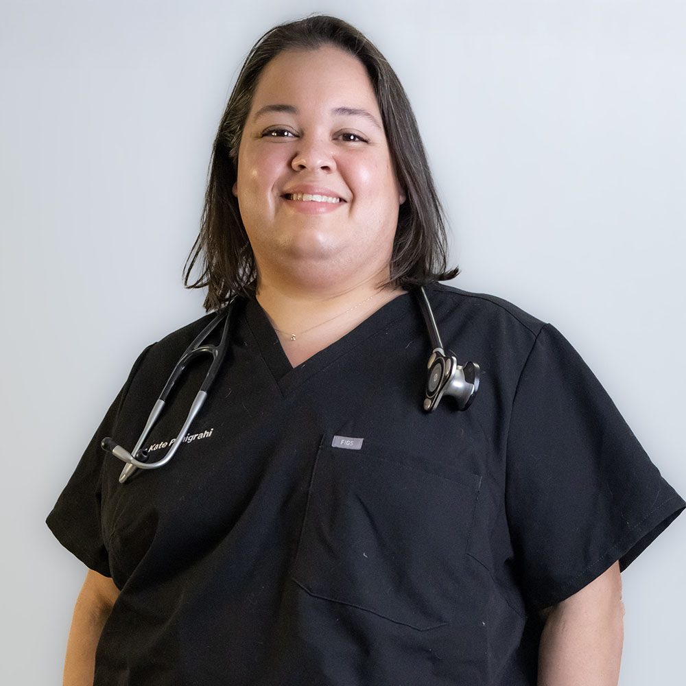 Dr. Kathryn Panigrahi smiling with her stethoscope around her neck